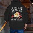 Be Nice To The Teacher Santa Is Watching School Christmas Men Zip Up Hoodie Back Print, funny gift Be Nice To The Teacher Santa Is Watching School Christmas Men Zip Up Hoodie Back Print, funny gift