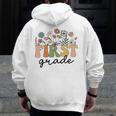 First Grade Teacher Wildflower Back To School Floral Outfits Men Zip Up Hoodie Back Print, First Grade Teacher Gifts, funny design First Grade Teacher Wildflower Back To School Floral Outfits Men Zip Up Hoodie Back Print, First Grade Teacher Gifts, funny design