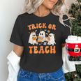 Teacher Halloween Trick Or Teach Retro Groovy Floral Ghost Unisex T-Shirt, Groovy Teacher Shirts, gift for family, gift for coworker Teacher Halloween Trick Or Teach Retro Groovy Floral Ghost Unisex T-Shirt, Groovy Teacher Shirts, gift for family, gift for coworker