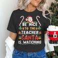 Be Nice To The Teacher Santa Is Watching Christmas Women's T-Shirt, gift for family, gift for coworker Be Nice To The Teacher Santa Is Watching Christmas Women's T-Shirt, gift for family, gift for coworker
