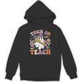 Trick Or Teach Groovy Teacher Halloween Retro Ghost Unisex Hoodie, Groovy Teacher Gifts, trending gift Trick Or Teach Groovy Teacher Halloween Retro Ghost Unisex Hoodie, Groovy Teacher Gifts, trending gift