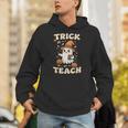 Halloween Teacher Shirts Women School Trick Or Teach Groovy Unisex Hoodie, Groovy Teacher Hoodies, funny gift