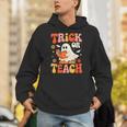 Trick Or Teach Halloween Shirt For Teacher Kids Floral Ghost Unisex Hoodie, funny gift Trick Or Teach Halloween Shirt For Teacher Kids Floral Ghost Unisex Hoodie, funny gift