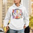 Trick Or Teach Retro Groovy Halloween Teacher Unisex Hoodie, Groovy Teacher Hoodies, funny gift