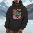 Helping Little Minds Grow Teacher First Day Back To School Unisex Hoodie, novelty gifts, funny gifts