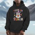 Trick Or Teach Teacher Groovy Ghost Halloween Teacher Unisex Hoodie, novelty gifts, funny gifts Trick Or Teach Teacher Groovy Ghost Halloween Teacher Unisex Hoodie, novelty gifts, funny gifts