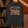 Fall In Love With Learning Autumn Teacher Thanksgiving Unisex Hoodie, gift for family, gift for coworker