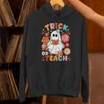 Groovy Halloween Trick Or Teach Retro Floral Ghost Teacher For Men Women Kids Unisex Hoodie, Groovy Teacher Hoodies, gift for family, gift for coworker Groovy Halloween Trick Or Teach Retro Floral Ghost Teacher For Men Women Kids Unisex Hoodie, Groovy Teacher Hoodies, gift for family, gift for coworker
