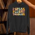 Groovy I Speak Fluent Toddler Daycare Provider Teacher Unisex Hoodie, Groovy Teacher Hoodies, gift for family, gift for coworker