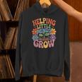 Helping Little Minds Grow Teacher First Day Back To School Unisex Hoodie, gift for family, gift for coworker