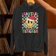 Santas Favorite Teacher Retro Groovy Smile Face Christmas Unisex Hoodie, Groovy Teacher Hoodies, gift for family, gift for coworker Santas Favorite Teacher Retro Groovy Smile Face Christmas Unisex Hoodie, Groovy Teacher Hoodies, gift for family, gift for coworker