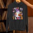 Trick Or Teach Groovy Teacher Ghost Halloween Teacher Unisex Hoodie, Groovy Teacher Hoodies, gift for family, gift for coworker