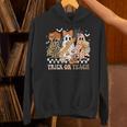 Trick Or Teach Groovy Teacher Halloween Floral Ghost Unisex Hoodie, Groovy Teacher Hoodies, gift for family, gift for coworker