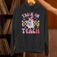 Trick Or Teach Halloween Teacher Floral Ghost Groovy Unisex Hoodie, Groovy Teacher Hoodies, gift for family, gift for coworker