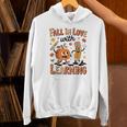 Retro Fall In Love With Learning Autumn Pumpkin Teacher Kids Unisex Hoodie, gift for family, gift for coworker