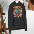 Helping Little Minds Grow Teacher First Day Back To School Women's Hoodie, funny gift Helping Little Minds Grow Teacher First Day Back To School Women's Hoodie, funny gift