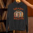 Fall In Love With Learning Book Lover Autumn Pumpkin Teacher Women's Hoodie, gift for family, gift for coworker