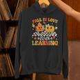 Fall In Love With Learning Fall Teacher Thanksgiving Retro Women's Hoodie, gift for family, gift for coworker
