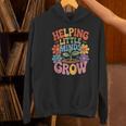 Helping Little Minds Grow Teacher First Day Back To School Women's Hoodie, gift for family, gift for coworker Helping Little Minds Grow Teacher First Day Back To School Women's Hoodie, gift for family, gift for coworker