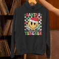 Santas Favorite Teacher Retro Groovy Smile Face Christmas Women's Hoodie, Groovy Teacher Hoodies, gift for family, gift for coworker Santas Favorite Teacher Retro Groovy Smile Face Christmas Women's Hoodie, Groovy Teacher Hoodies, gift for family, gift for coworker