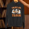 Teacher Halloween Trick Or Teach Retro Groovy Floral Ghost Women's Hoodie, Groovy Teacher Hoodies, gift for family, gift for coworker Teacher Halloween Trick Or Teach Retro Groovy Floral Ghost Women's Hoodie, Groovy Teacher Hoodies, gift for family, gift for coworker
