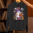 Trick Or Teach Groovy Teacher Ghost Halloween Teacher Women's Hoodie, Groovy Teacher Hoodies, gift for family, gift for coworker Trick Or Teach Groovy Teacher Ghost Halloween Teacher Women's Hoodie, Groovy Teacher Hoodies, gift for family, gift for coworker