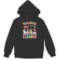 Teaching Future Leaders Groovy Teacher Back To School Women's Hoodie, novelty gifts, funny gifts