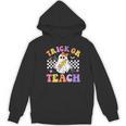 Trick Or Teach Groovy Halloween Teachers Women's Hoodie, novelty gifts, funny gifts Trick Or Teach Groovy Halloween Teachers Women's Hoodie, novelty gifts, funny gifts