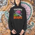 Teachers Love Brains Halloween 2025 Skeleton Costume Men Hoodie, gift for family, gift for coworker Teachers Love Brains Halloween 2025 Skeleton Costume Men Hoodie, gift for family, gift for coworker