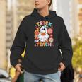 Groovy Halloween Trick Or Teach Retro Floral Ghost Teacher For Men Women Kids Men Hoodie, Groovy Teacher Hoodies, funny gift