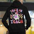 Trick Or Teach Halloween Teacher Floral Ghost Groovy Men's Hoodie Back Print, Groovy Teacher Hoodies, funny gift