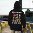 We All Grow At Different Rates Back To School Teacher Men's Hoodie Back Print, funny design