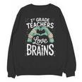 1st Grade Teachers Love Brains Shirt Halloween Teacher Unisex Sweatshirt, trending gift