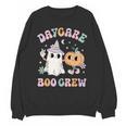 Daycare Boo Crew Groovy Halloween Floral Ghost Kid Teacher Unisex Sweatshirt, Groovy Teacher Gifts, trending gift