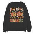 Fall In Love With Learning Retro Autumn Thanksgiving Teacher Unisex Sweatshirt, trending gift Fall In Love With Learning Retro Autumn Thanksgiving Teacher Unisex Sweatshirt, trending gift
