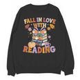 Fall In Love With Reading Halloween Stack Of Book Teacher Unisex Sweatshirt, trending gift Fall In Love With Reading Halloween Stack Of Book Teacher Unisex Sweatshirt, trending gift