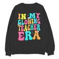 In My Glowing Teacher Era Groovy Colorful Bright Unisex Sweatshirt, Groovy Teacher Gifts, trending gift In My Glowing Teacher Era Groovy Colorful Bright Unisex Sweatshirt, Groovy Teacher Gifts, trending gift