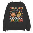 Groovy Fall In Love With Learning Autumn Pumpkin Teacher Unisex Sweatshirt, Groovy Teacher Gifts, trending gift Groovy Fall In Love With Learning Autumn Pumpkin Teacher Unisex Sweatshirt, Groovy Teacher Gifts, trending gift
