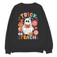 Groovy Halloween Trick Or Teach Retro Floral Ghost Teacher For Men Women Kids Unisex Sweatshirt, Groovy Teacher Gifts, trending gift Groovy Halloween Trick Or Teach Retro Floral Ghost Teacher For Men Women Kids Unisex Sweatshirt, Groovy Teacher Gifts, trending gift