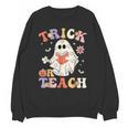 Groovy Halloween Trick Or Teach Retro Floral Ghost Teacher Unisex Sweatshirt, Groovy Teacher Gifts, trending gift Groovy Halloween Trick Or Teach Retro Floral Ghost Teacher Unisex Sweatshirt, Groovy Teacher Gifts, trending gift
