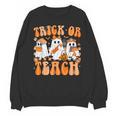 Groovy Teacher Halloween Trick Or Teach Ghost Men Women Kids Unisex Sweatshirt, Groovy Teacher Gifts, trending gift Groovy Teacher Halloween Trick Or Teach Ghost Men Women Kids Unisex Sweatshirt, Groovy Teacher Gifts, trending gift