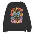 Helping Little Minds Grow Teacher First Day Back To School Unisex Sweatshirt, trending gift Helping Little Minds Grow Teacher First Day Back To School Unisex Sweatshirt, trending gift