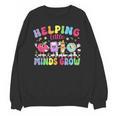 Helping Little Minds Grow Teacher Life Back To School Unisex Sweatshirt, trending gift