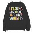 Learning Is Out Of This World Space Teacher Cute Groovy Unisex Sweatshirt, Groovy Teacher Gifts, trending gift