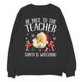 Be Nice To The Teacher Santa Is Watching School Christmas Unisex Sweatshirt, trending gift Be Nice To The Teacher Santa Is Watching School Christmas Unisex Sweatshirt, trending gift