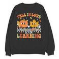 Retro Pumpkin Fall In Love With Learning Autumn Teacher Unisex Sweatshirt, trending gift Retro Pumpkin Fall In Love With Learning Autumn Teacher Unisex Sweatshirt, trending gift