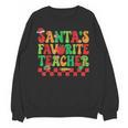 Santas Favorite Teacher Retro Groovy Christmas Xmas Women Unisex Sweatshirt, Groovy Teacher Gifts, trending gift Santas Favorite Teacher Retro Groovy Christmas Xmas Women Unisex Sweatshirt, Groovy Teacher Gifts, trending gift