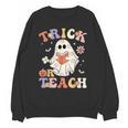 Teacher Halloween Trick Or Teach Floral Ghost Unisex Sweatshirt, trending gift Teacher Halloween Trick Or Teach Floral Ghost Unisex Sweatshirt, trending gift