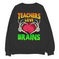 Teacher Teachers Love Brains Skeleton Hand Heart Halloween Unisex Sweatshirt, trending gift Teacher Teachers Love Brains Skeleton Hand Heart Halloween Unisex Sweatshirt, trending gift