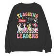 Teaching Future Leaders Groovy Teacher Back To School Unisex Sweatshirt, Future Teacher Gifts, Groovy Teacher Gifts, trending gift